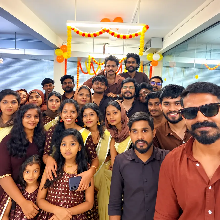 Team members at a festival celebration in the decorated office